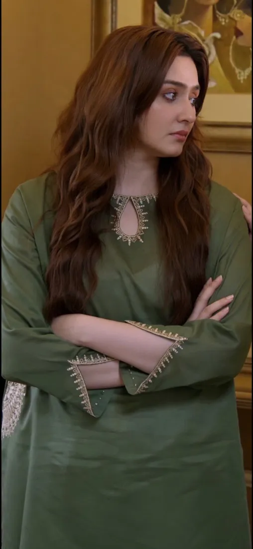 Durefishan Saleem in an olive-green outfit, looking to the side